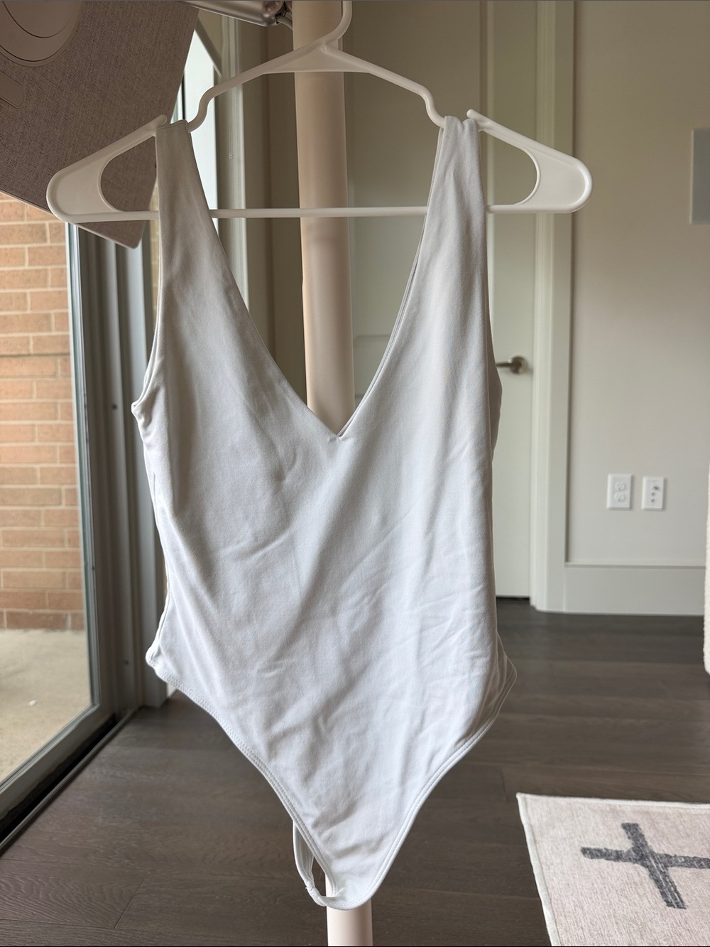Aritzia White V-Neck Ribbed Bodysuit